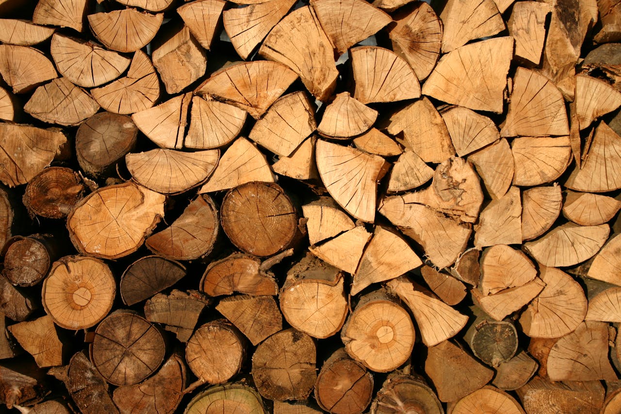 Crafting Captivating Headlines: Your awesome post title goes here Close-up of stacked firewood showing natural textures and wood grain patterns.